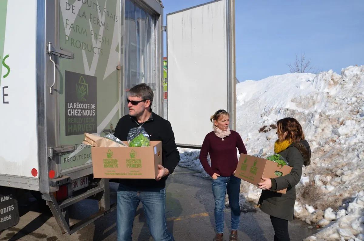 Workers with Really Local Harvest deliver fresh produce. Really Local Harvest is a food hub in New Brunswick that aggregates products from 30 local producers and distributes them to consumers, restaurants, and schools. (Courtesy Really Local Harvest)