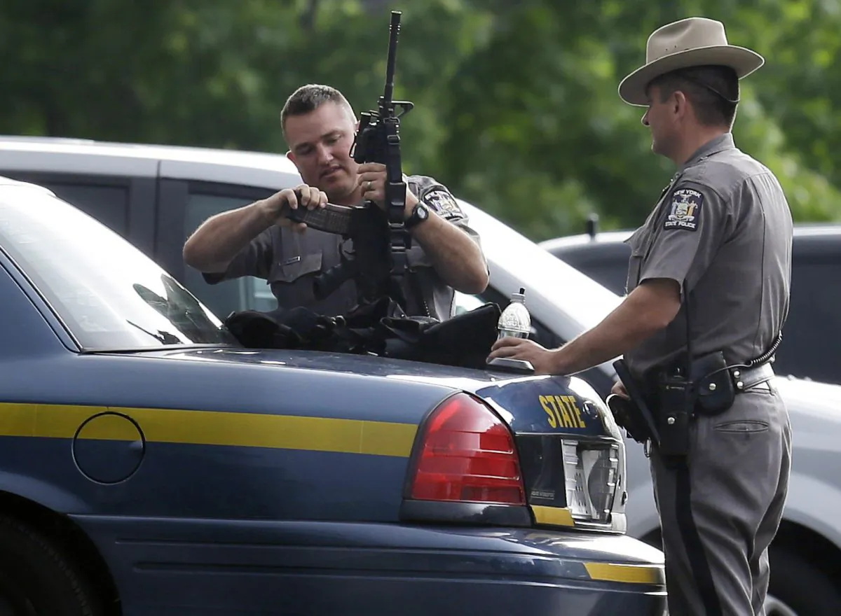 New York State Police prepare their equipment during a search for two escaped prisoners near Dannemora, N.Y., Thursday, June 11, 2015. (AP Photo/Seth Wenig)