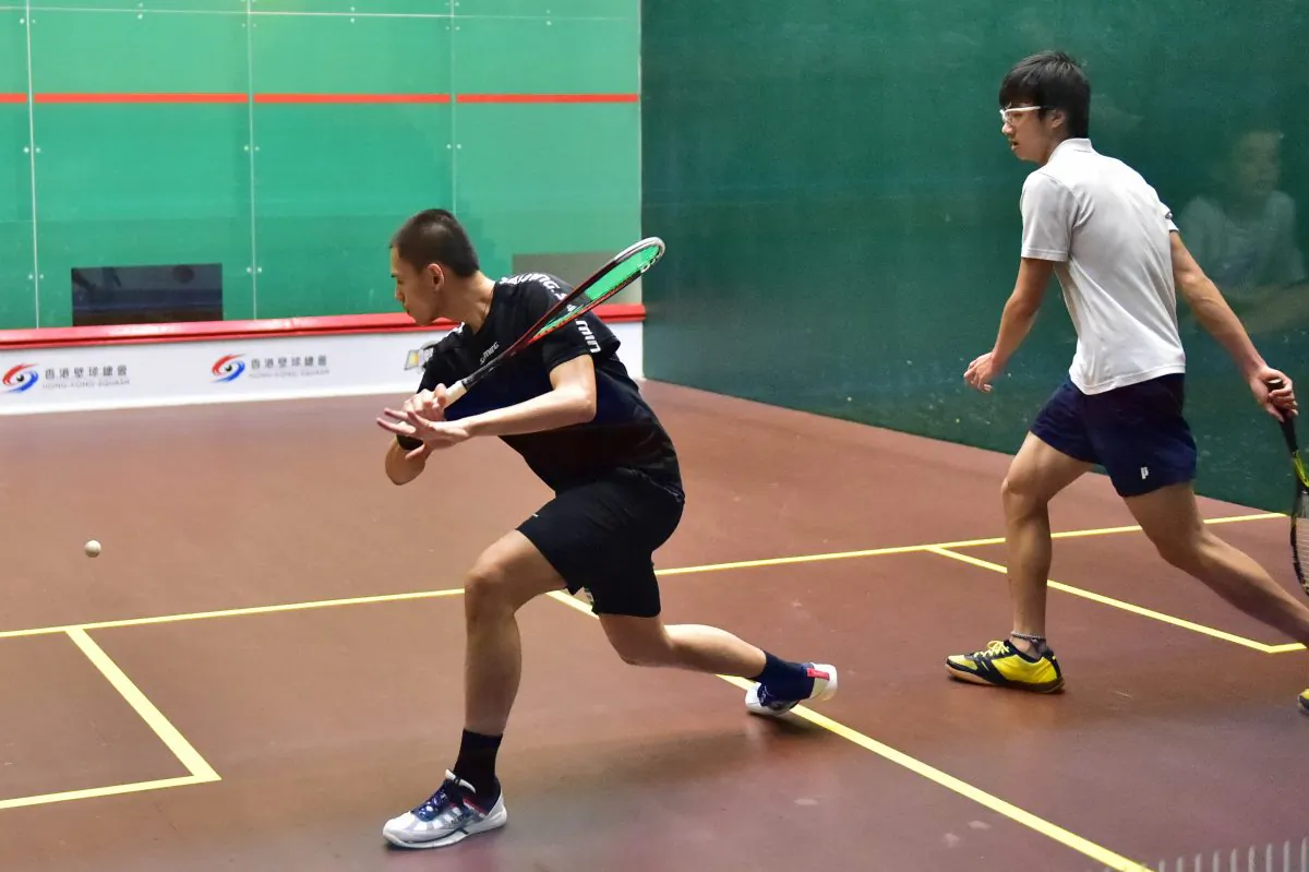 Max Lee Ho Yin playing against Yuen Tsun Hei in the quarter final of the Hong Kong National Championships at the Hong Kong Squash Centre on Thursday June 11, 2015. Lee won in 4-games 11-5, 10-12, 11-9, 11-7 to move on to play Wong Chi Him in the semi-final on Friday June 12. (Bill Cox/Epoch Times)