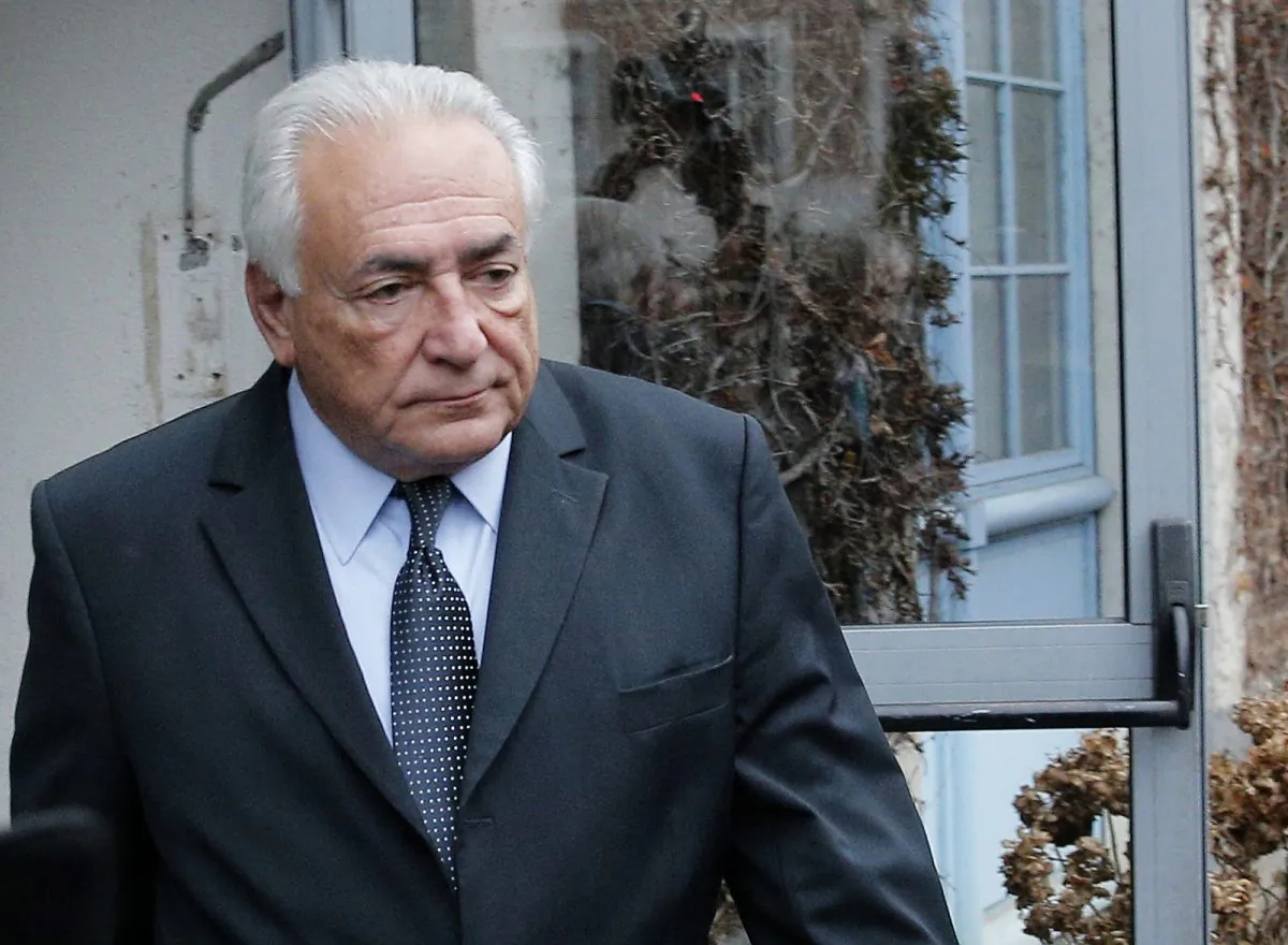 former Managing Director of International Monetary Fund Dominique Strauss Kahn leaving his hotel in Lille, northern France, as he goes on trial for sex charges at a court. Dominique Strauss-Kahn faces a verdict Friday in the last of a string of legal cases that started when a New York hotel maid accused him of sexual assault in 2011. (AP Photo/Christophe Ena)