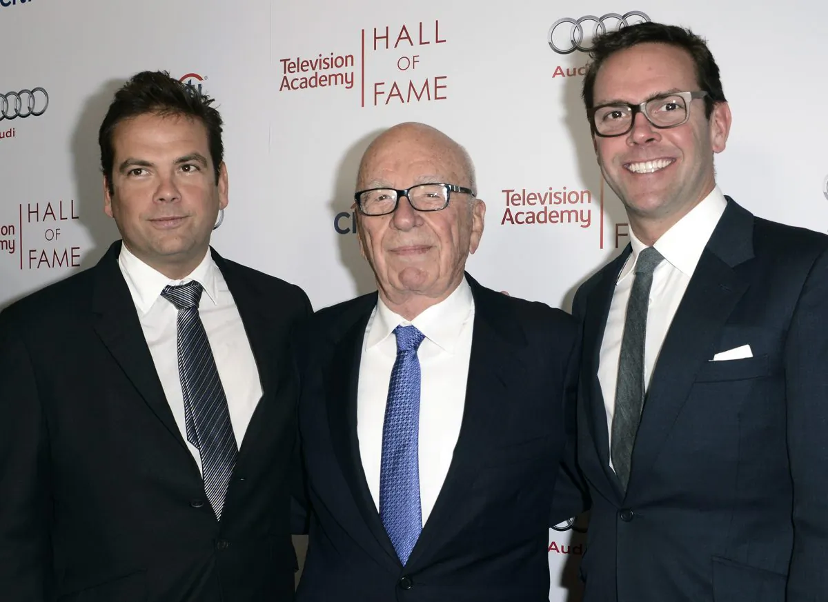 News Corp. Execuctive Chairman Rupert Murdoch, center, flanked by his sons, Lachlan, left, and News Corp Deputy COO James Murdoch attend the 2014 Television Academy Hall of Fame in Beverly Hills, Calif., on March 11, 2014. (Dan Steinberg/Invision/AP Images)