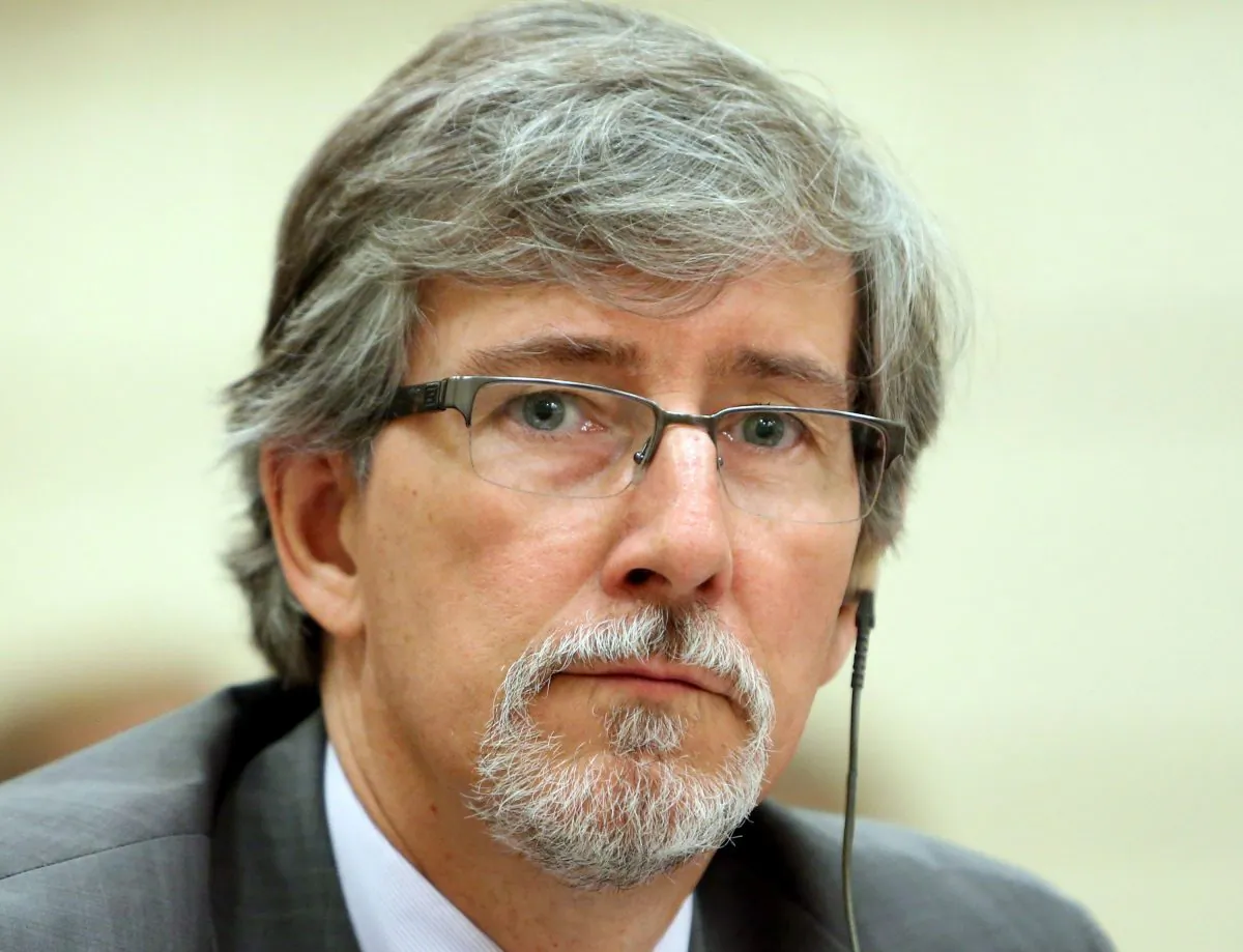 Privacy Commissioner Daniel Therrien waits before appearing at the Commons human rights committee on Parliament Hill June 10, 2014. Upon releasing his annnual privacy report this week, Therrien said said 2014 was a landmark year for international collaboration on privacy. (The Canadian Press/Fred Chartrand)