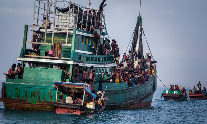 Rohingya migrants on a boat off Indonesia's coast await rescue on May 20. The Muslim Rohingya minority group is fleeing persecution in Burma. (JANUAR/AFP/Getty Images) 