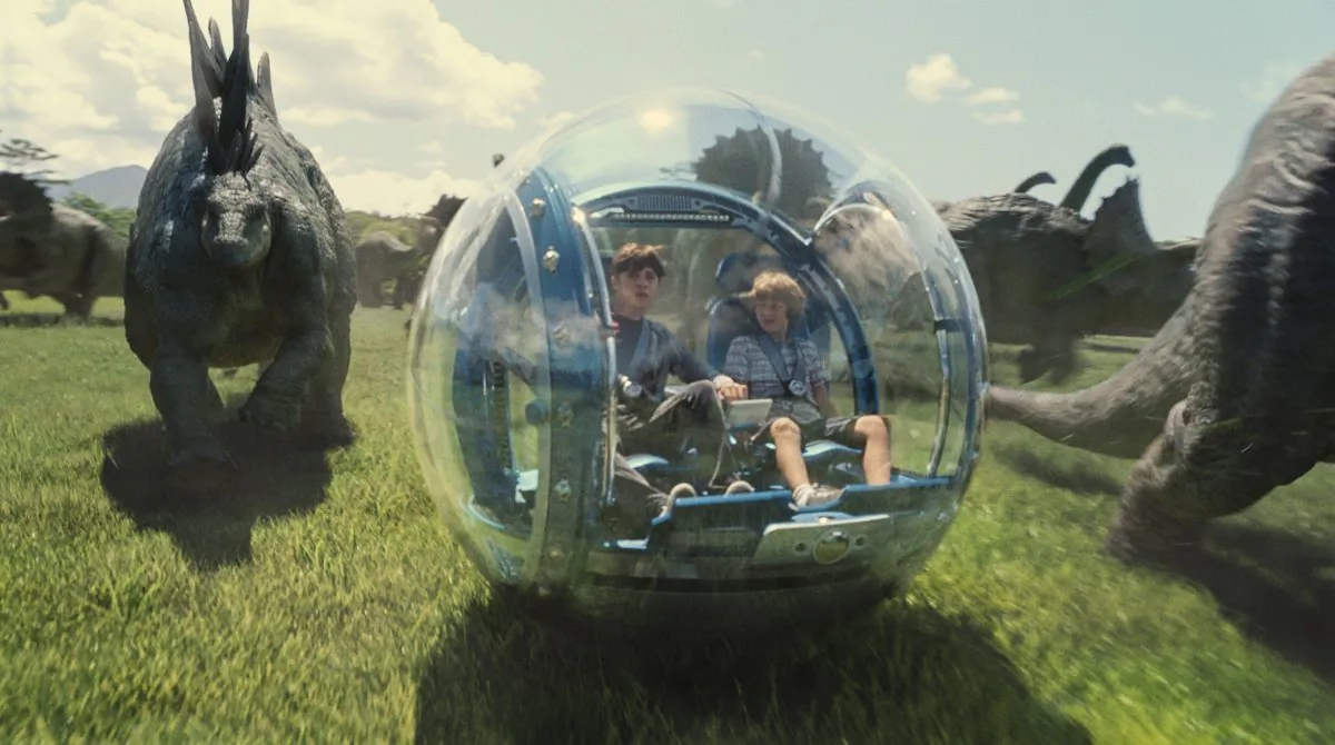 This photo provided by Universal Pictures shows, Nick Robinson (L) as Zach, and Ty Simpkins as Gray, in a scene from the film, "Jurassic World," directed by Colin Trevorrow, in the next installment of Steven Spielberg's groundbreaking "Jurassic Park" series.