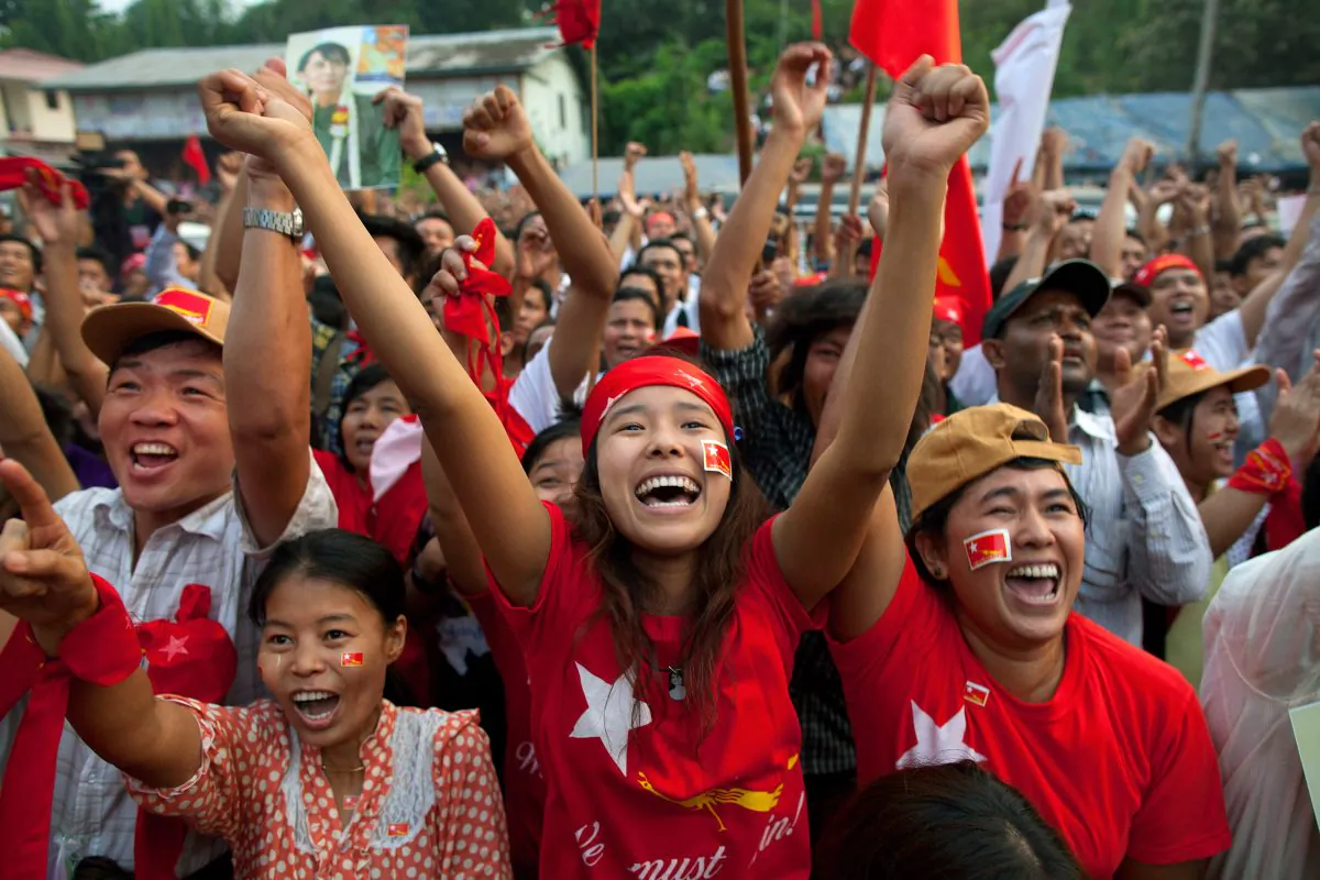 National League for Democracy (NLD) supporters celebrate their victory in the parliamentary elections outside the party headquarters in Yangon, Burma, on April 1, 2012. (Paula Bronstein/Getty Images)