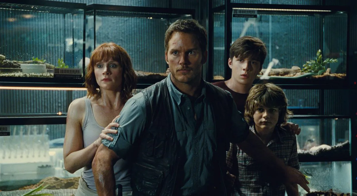 (L to R) Claire (Bryce Dallas Howard), Owen (Chris Pratt), Zach (Nick Robinson) and Gray (Ty Simpkins) watch in terror in "Jurassic World" (Universal Pictures/Amblin Entertainment)