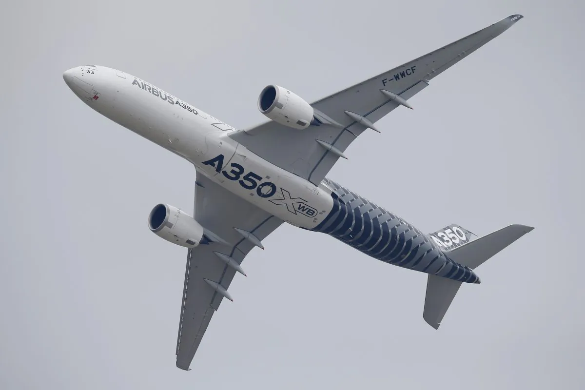 An Airbus A350 performs its demonstration flight during the Paris Air Show, at Le Bourget airport, north of Paris, Monday, June 15, 2015. Some 300,000 aviation professionals and spectators are expected at this weeks Paris Air Show, coming from around the world to make business deals and see dramatic displays of aeronautic prowess and the latest air and space technology. (AP Photo/Francois Mori)