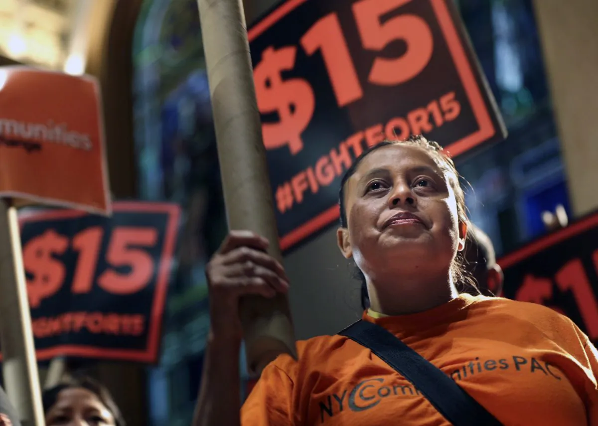 Demonstrators rally for a $15 minimum wage before a meeting of the wage board in New York. (Seth Wenig)
