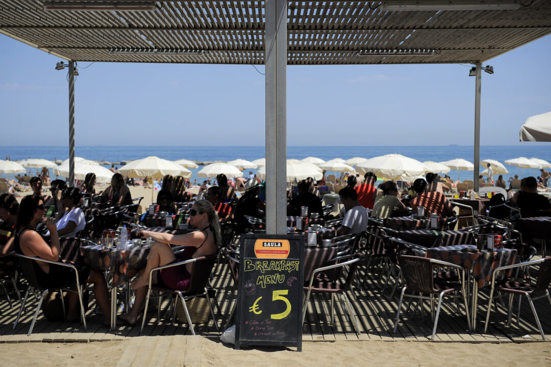 A sign shows the price in Euros for a breakfast menu in a restaurant on the La Barceloneta beach on June 22, 2011 in Barcelona, Spain. (David Ramos/Getty Images)