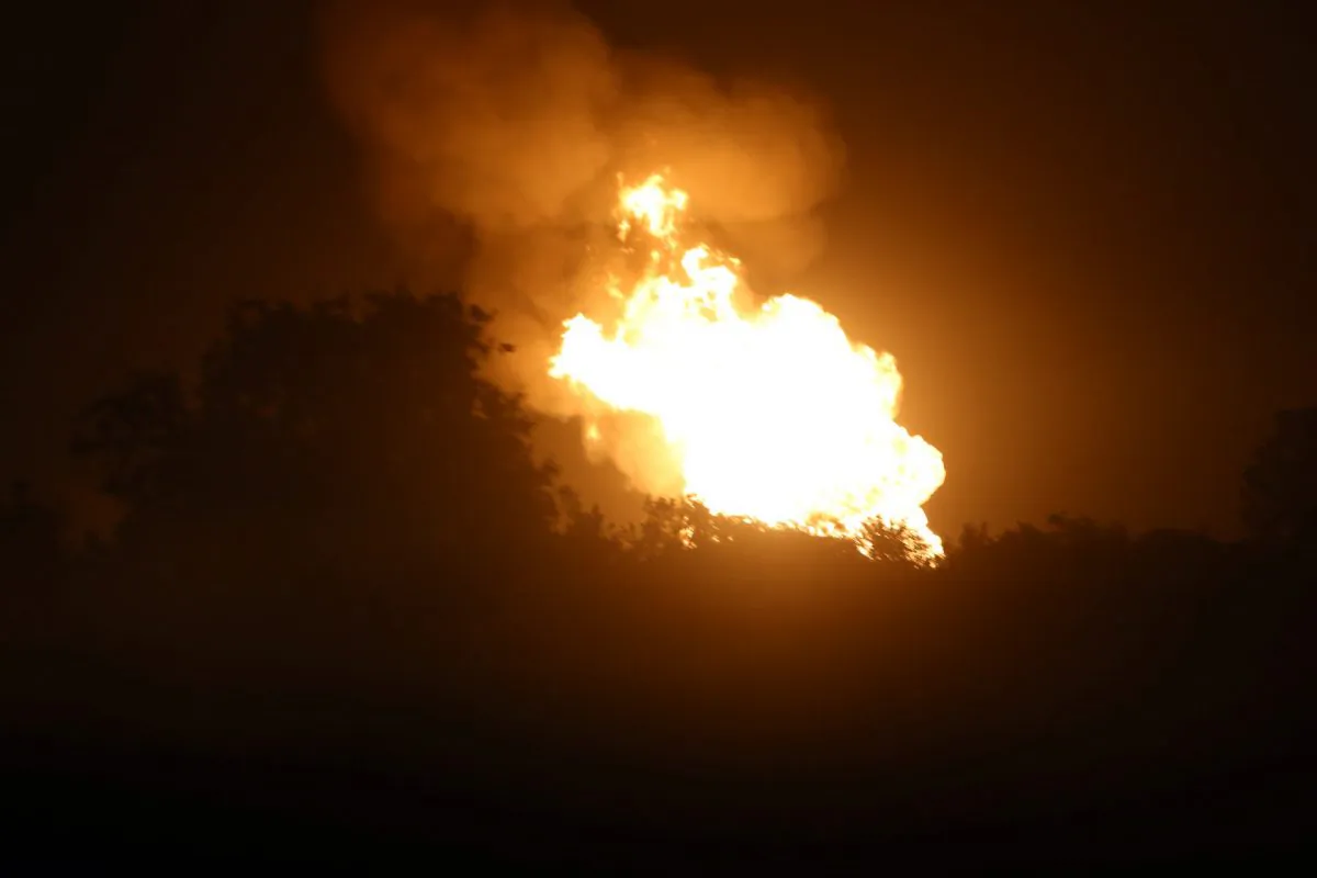 Fire after a pipeline explosion in rural DeWitt County, Texas, illuminates the horizon Sunday, June 14, 2015. (Richard Hoang/The Victoria Advocate via AP)