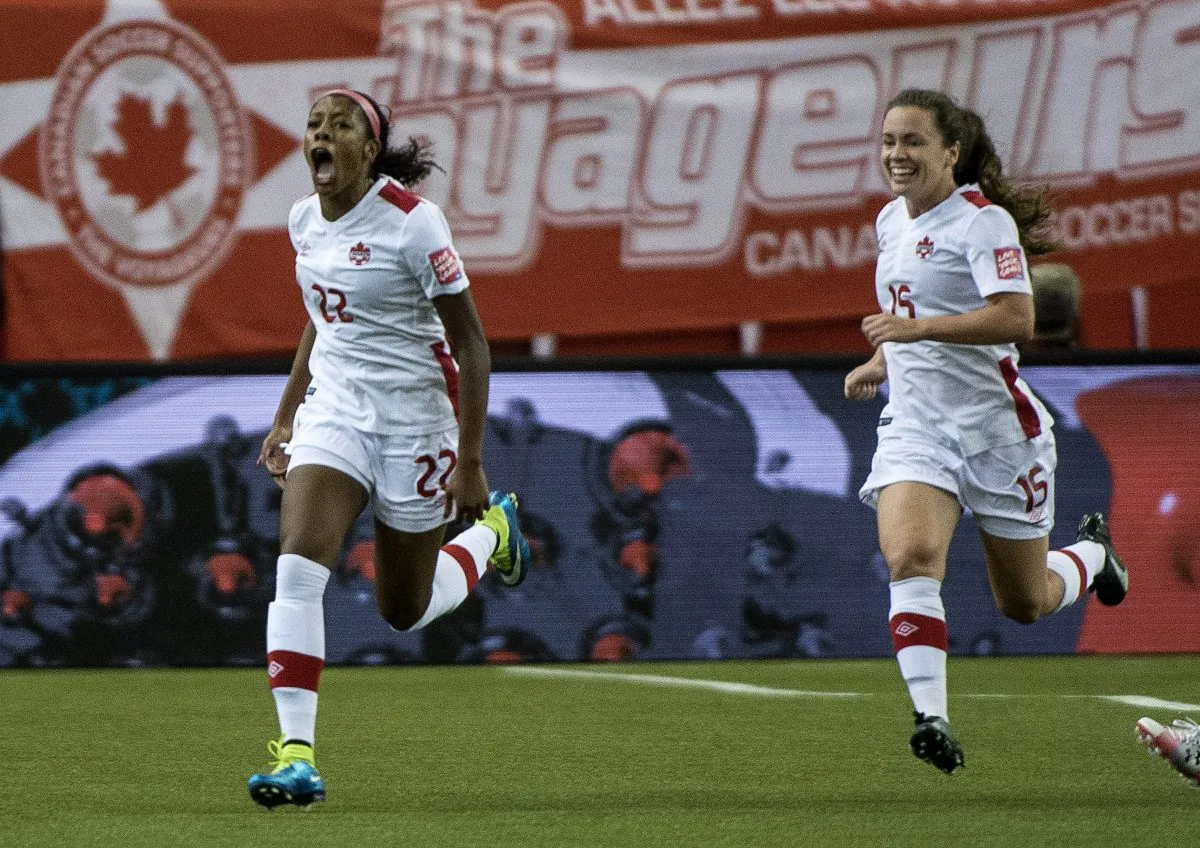 Canadian midfielder Ashley Lawrence (L) celebrates her goal against Netherlands along with teammate Allysha Chapman in FIFA Women's World Cup action on June 15, 2015 in Montreal. (The Canadian Press/Paul Chiasson)