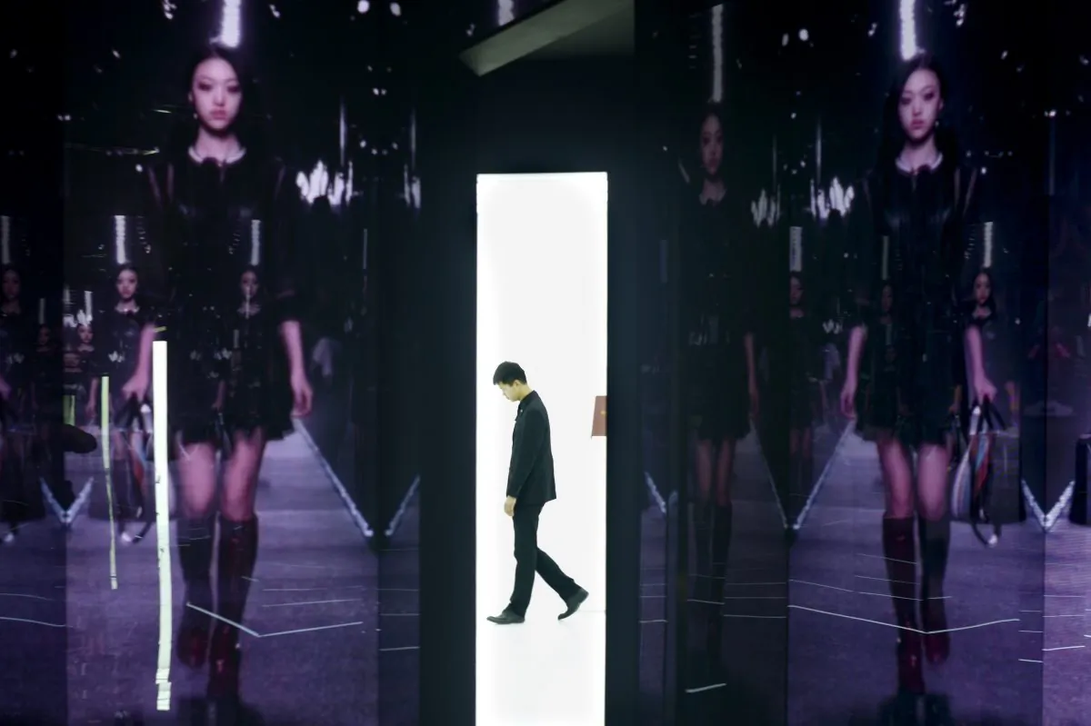 A man walks past a showroom exhibition by French luxury brand Louis Vuitton in Beijing on April 9, 2015.  China is widely considered the world's biggest luxury market as a rising middle class and corrupt officials drive a shopping frenzy, but domestic prices are high due to hefty import taxes and huge retail mark-ups. (Wang Zhao/AFP/Getty Images)