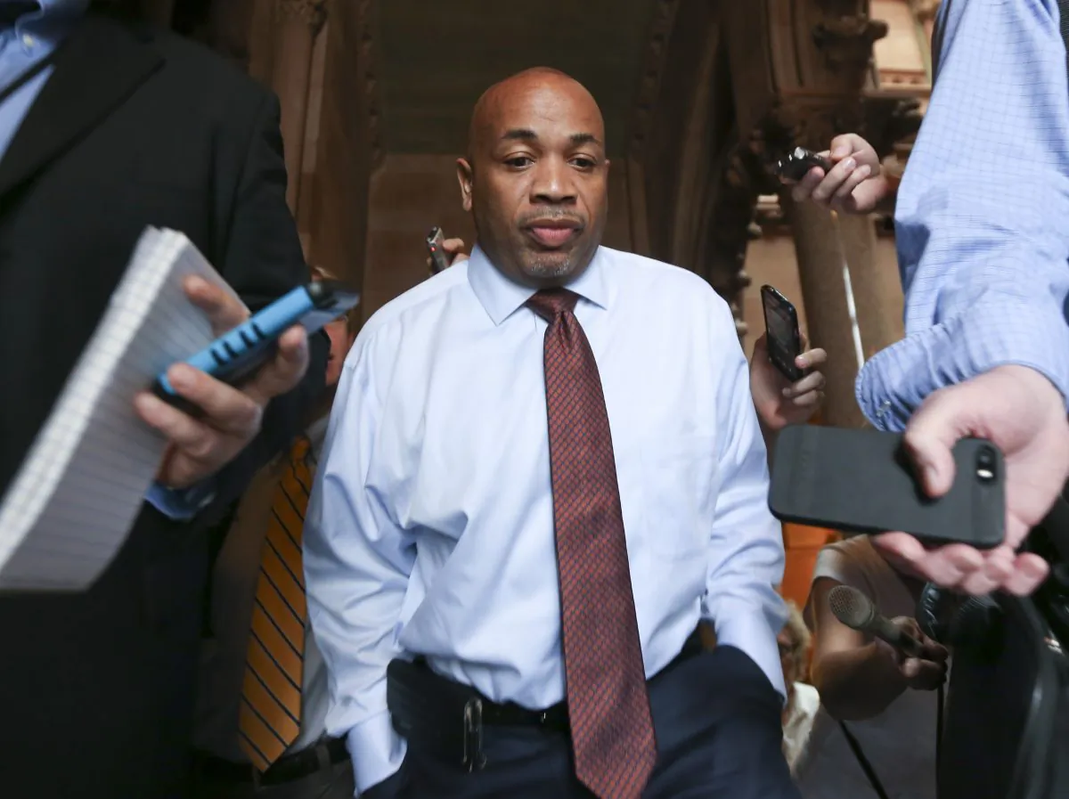 Assembly Speaker Carl Heastie, D-Bronx, is followed by reporters after leaving Gov. Andrew Cuomo's office at the Capitol on Tuesday, June 16, 2015, in Albany, N.Y. Lawmakers remain far apart on a deal to renew the rent regulations covering 2 million New York City residents after the long-standing tenant protections expired at midnight Monday. (AP Photo/Mike Groll)