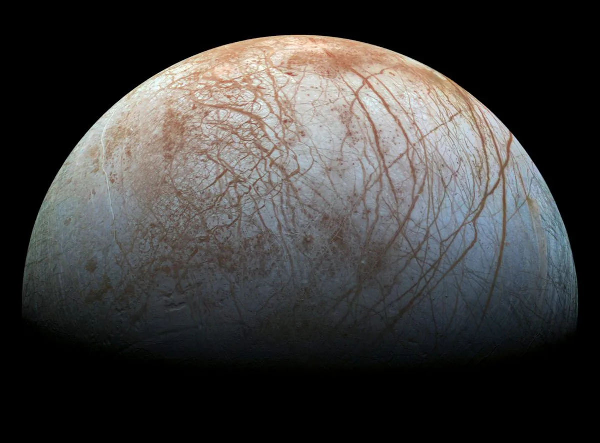 "On Europa it won't just be a lake. There's an ocean that goes around the entire sphere and there may be more water in that ocean than in our oceans. Maybe twice as much. We want to know exactly where that ocean is," says William McKinnon. (NASA/JPL-Caltech/SETI Institute)