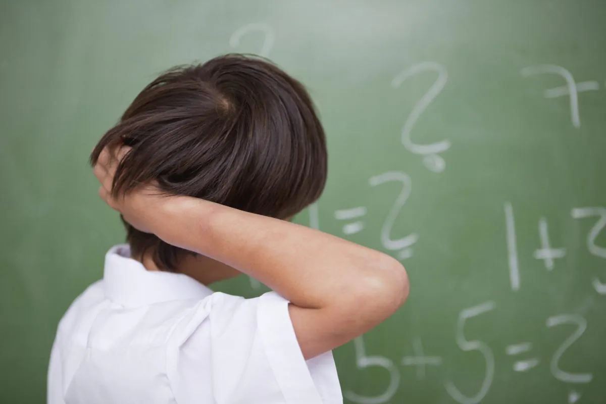 "Although our natural inclination may be to step in and guide children through the difficult tasks, it may actually undermine their efforts and deprive them of the opportunity to make sense of the math problem on their own," says Emily Fyfe.  (4774344sean/iStock)