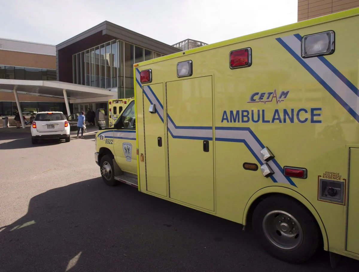 An ambulance drives up to a hospital in Longueuill, Quebec. (The Canadian Press/Ryan Remiorz)