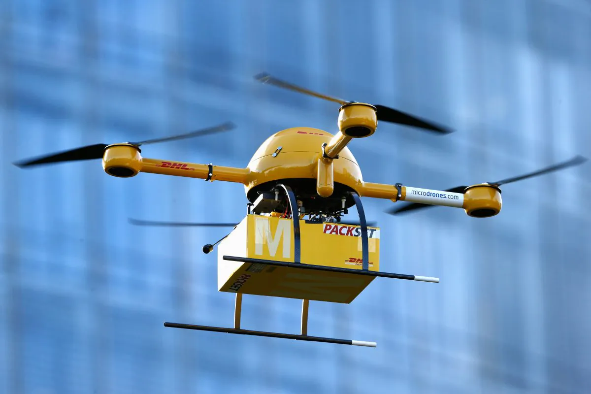 A quadcopter drone arrives with a small delivery at Deutsche Post headquarters on December 9, 2013 in Bonn, Germany. (Andreas Rentz/Getty Images)