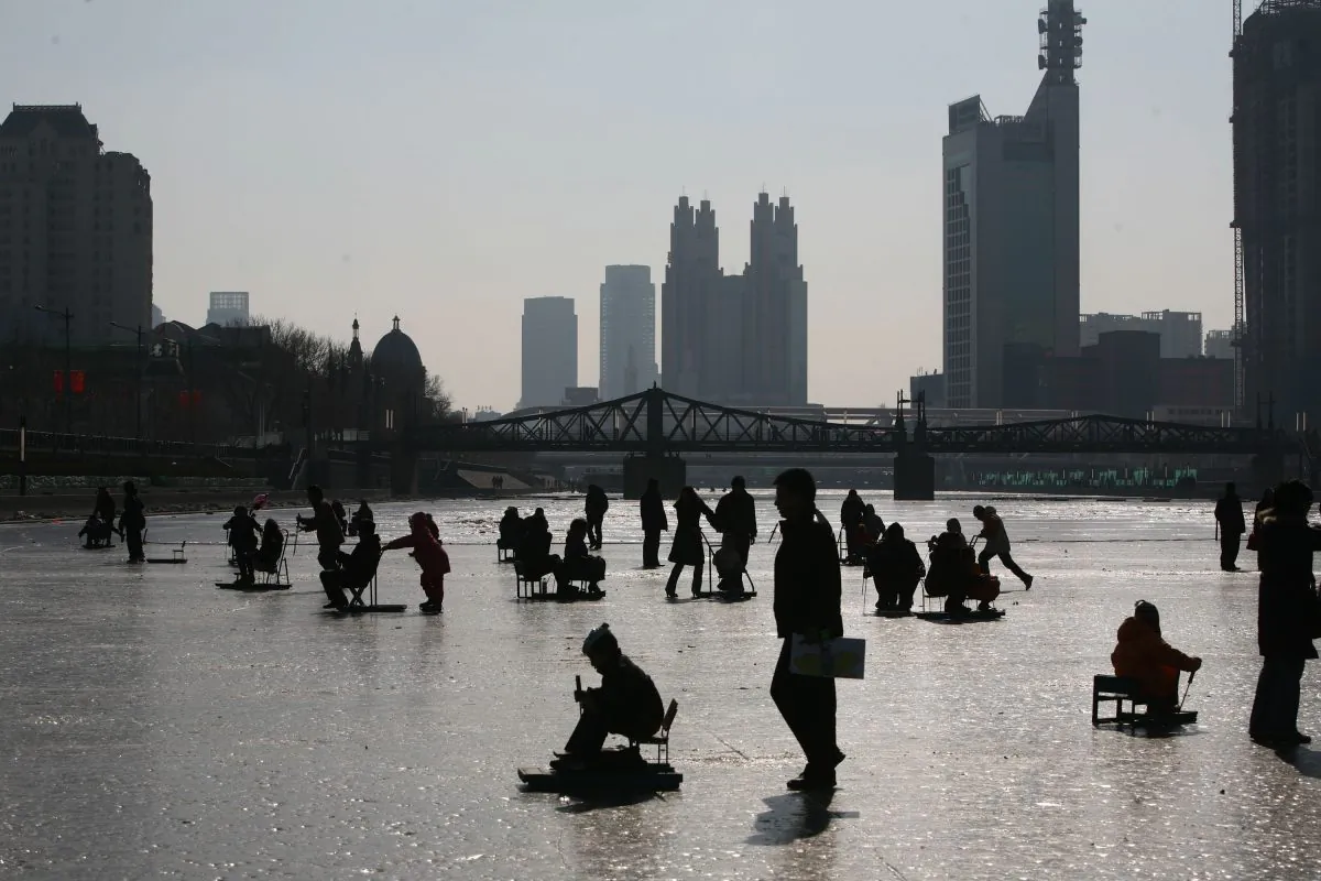People play on the frozen Haihe River on January 26, 2009 in Tianjin, China. (China Photos/Getty Images)