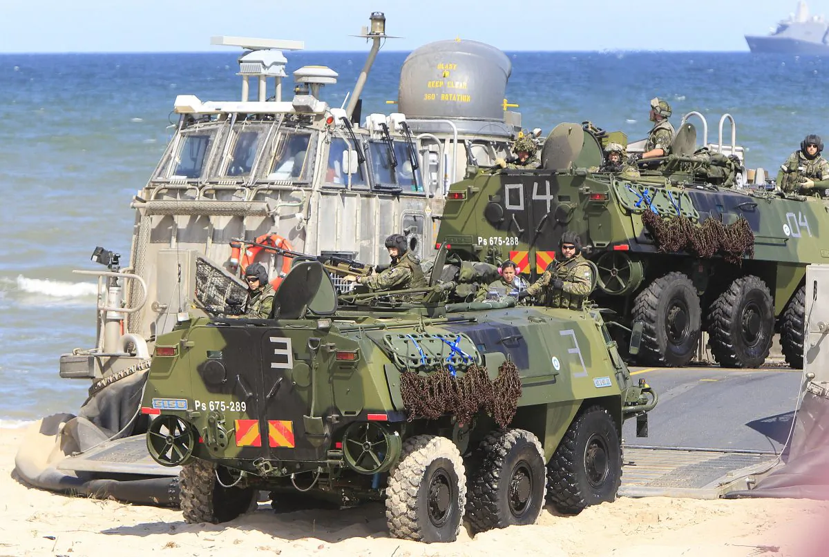 Soldiers sit atop of amphibious vehicles as NATO troops participate in the NATO sea exercises BALTOPS 2015 that are to reassure the Baltic Sea region allies in the face of a resurgent Russia, in Ustka, Poland, Wednesday, June 17, 2015. (AP/Czarek Sokolowski)