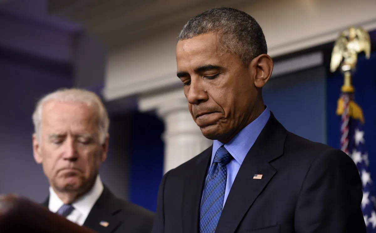 President Barack Obama, accompanied by Vice President Joe Biden, pauses while speaking in the Brady Press Briefing Room of the White House in Washington, Thursday, June 18, 2015, on the church shooting in Charleston, S.C. (AP Photo/Susan Walsh)
