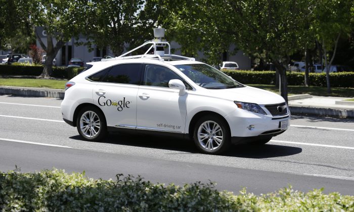 A Google self-driving car goes on a test drive near the Computer History Museum in Mountain View, California on May 13, 2014. (AP Photo/Eric Risberg, File)