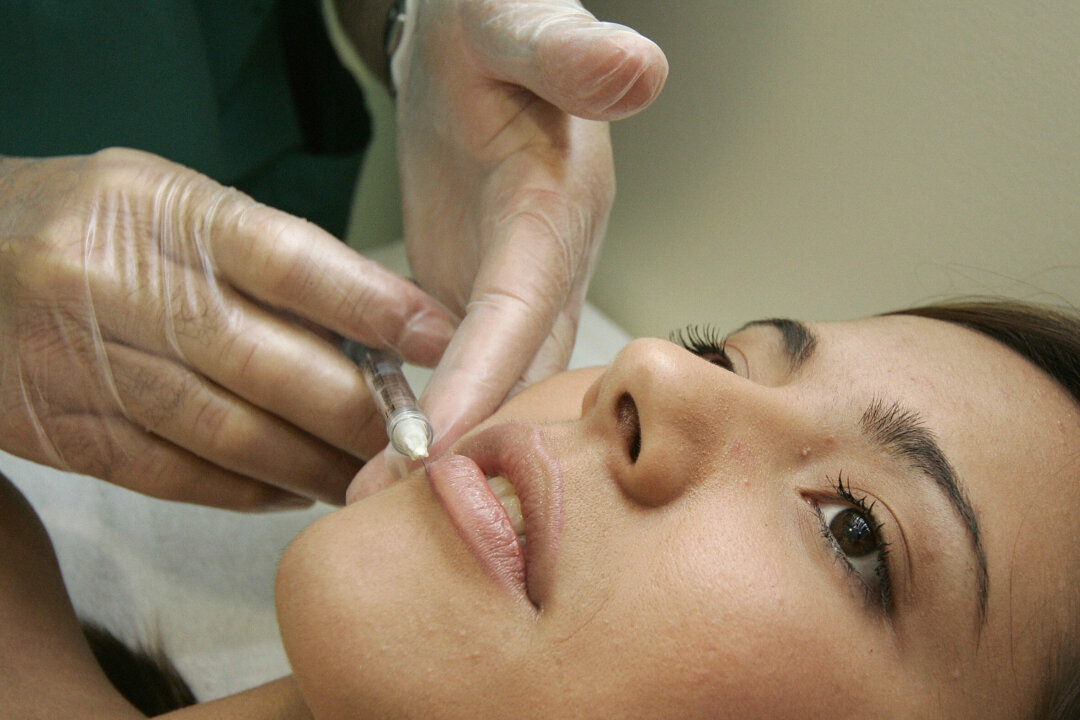 A woman receives a treatment at cosmetic surgery practice. (Jose Jordan/AFP/Getty Images)
