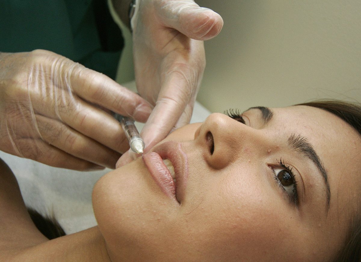 A woman receives a treatment at cosmetic surgery practice. (Jose Jordan/AFP/Getty Images)