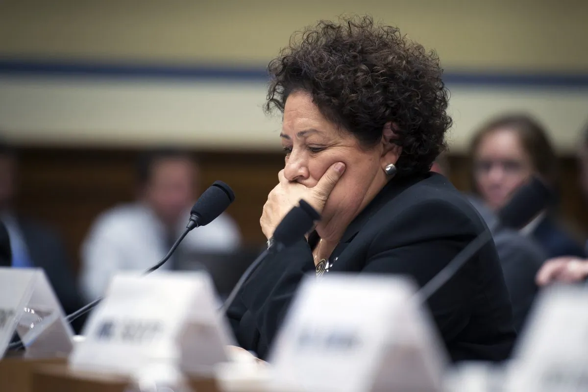 FILE - In this June 16, 2015 file photo, Office of Personnel Management (OPM) Director Katherine Archuleta pauses while testifying on Capitol Hill in Washington.  (AP Photo/Cliff Owen)