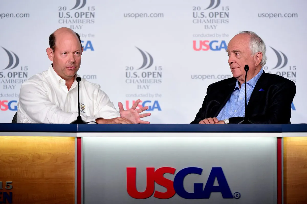 USGA Executive Director Mike Davis (R) talks with golf course architect Robert Trent Jones, Jr. during a press conference prior to the start of the 115th U.S. Open Championship at Chambers Bay on June 15, 2015 in University Place, Washington. (Harry How/Getty Images) 