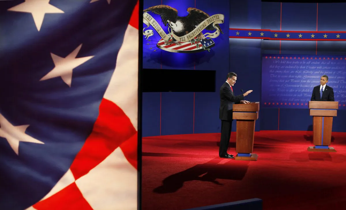 In this Oct. 3, 2012 photo, President Barack Obama, right, listens to Republican presidential nominee Mitt Romney during a presidential debate at the University of Denver in Denver. (AP Photo/David Goldman)