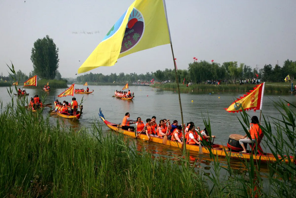 This picture taken on June 20, 2015 shows dragon boats setting off on the annual race along a river in Binzhou, northeast China's Shandong province. Dragon boat racing dates back over 2,000 years and has now developed into a serious sport on the calendar of many countries around the world. (STR/AFP/Getty Images)