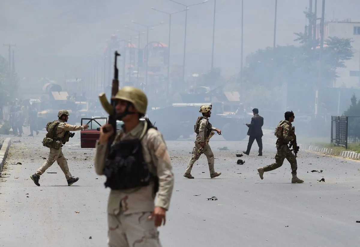 Afghan security personnel take position at the site of an attack in front of The Parliament Building in Kabul on June 22, 2015. (SHAH MARAI/AFP/Getty Images)