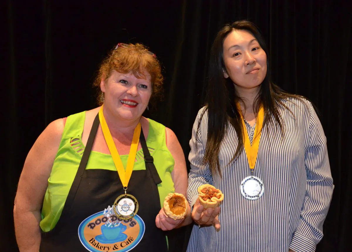Winners of the Best Butter Tart Festival and Contest are Diane Rogers of Doo Doo’s Bakery in Balieborough (L), who won in the professional division with her pumpkin butter tart, and Hisako Niimi of Ottawa who took first place in the home division with her banana-bacon-peanut butter entry. (Parm Parmar) 