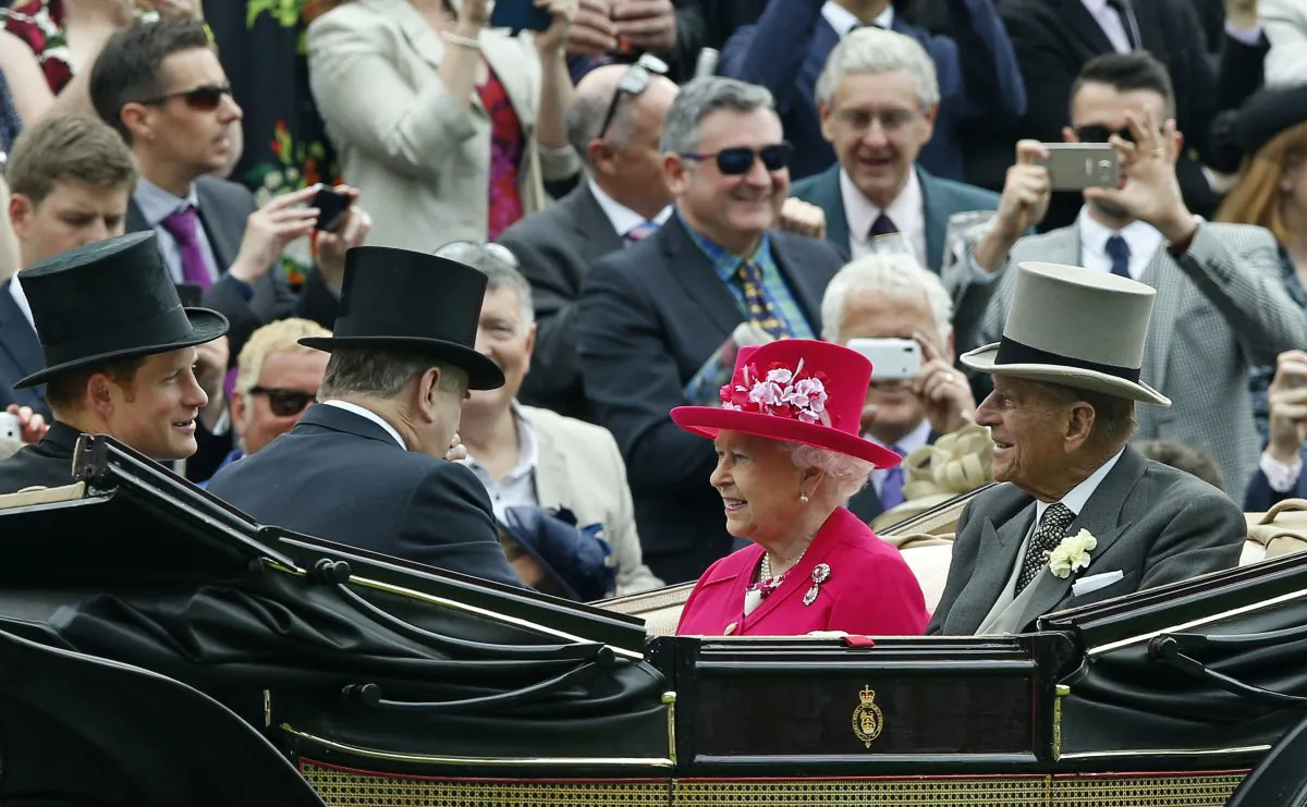 Britain's Queen Elizabeth II arriving with Prince Philip, the Duke of Edinburgh and Prince Harry for the first day of Royal Ascot horse racing meet at Ascot, England. The queen is planning to leave Tuesday, June 23, 2015, on a state visit to Germany that will include her first visit to a former concentration camp site. She and her husband Prince Philip plan to visit the Bergen-Belsen camp where diarist Anne Frank and her sister Margot died just weeks before the British liberated it on April 15, 1945. (AP/Alastair Grant)