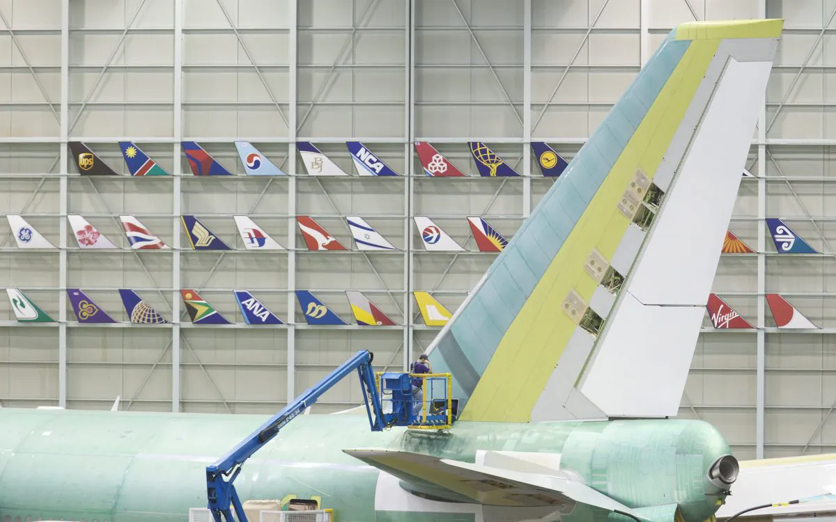 A Boeing employee works on the tail of a Boeing 747-8 Intercontinental June 13, 2012 at the Boeing Factory in Everett, Washington. (Stephen Brashear/Getty Images)