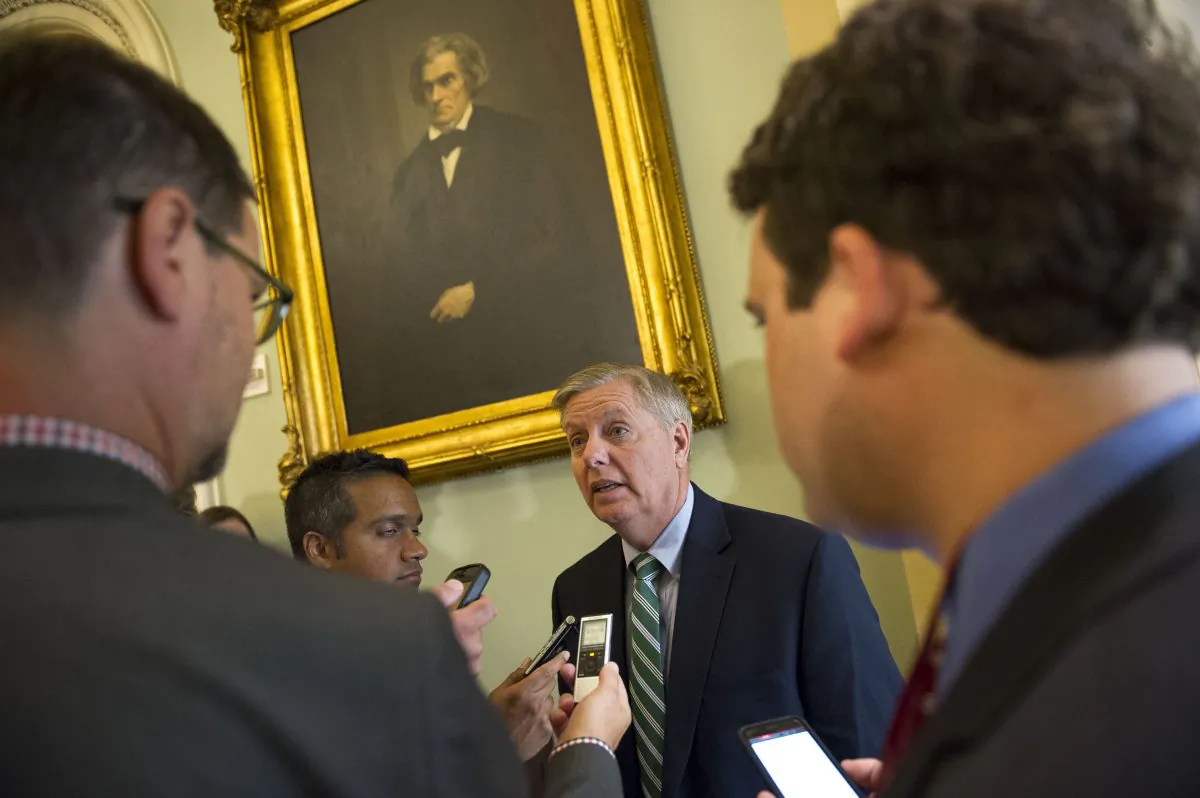 Sen. Lindsey Graham, R-S.C., speaks with reporters before attending a policy luncheon at the U.S. Capitol in Washington, Tuesday, June 23, 2015. The Senate pushed bipartisan trade legislation to the brink of final approval Tuesday in a combined effort by President Barack Obama and Republican congressional leaders to rescue a measure that appeared all but dead less than two weeks ago. (AP/Cliff Owen)
