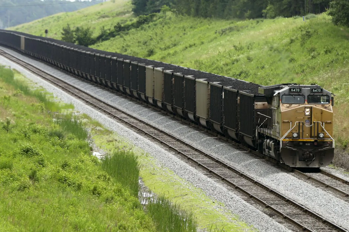 A train pulling coal rides through Redfield, Ark., on June 2, 2014. (AP Photo/Danny Johnston)