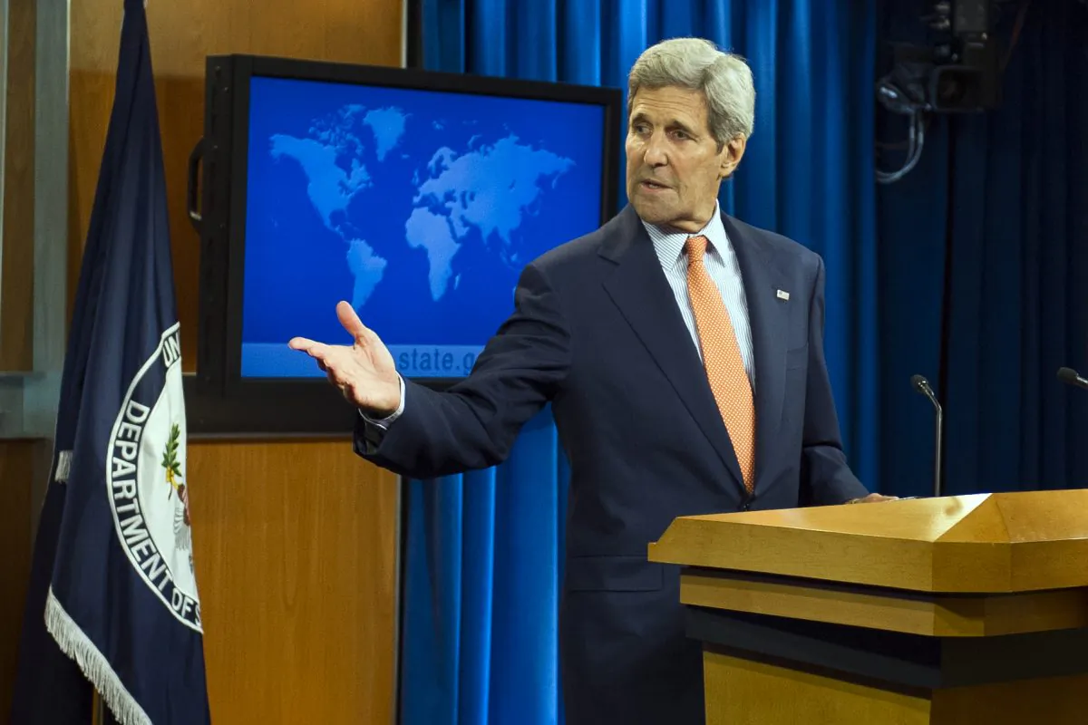 Secretary of State John Kerry asks an aide to bring him his crutches after speaking to the news media at the State Department in Washington, Thursday, June 25, 2015, as the State Department released it's annual human rights report. (AP Photo/Cliff Owen)