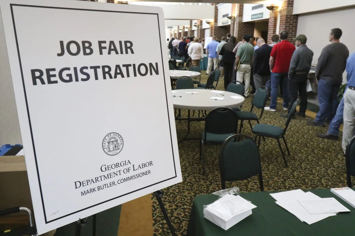 In this April 2, 2015, photo, a crowd gathers for a huge 15-county job fair at The Colonnade in Ringgold, Ga. (Dan Henry/Chattanooga Times Free Press via AP)