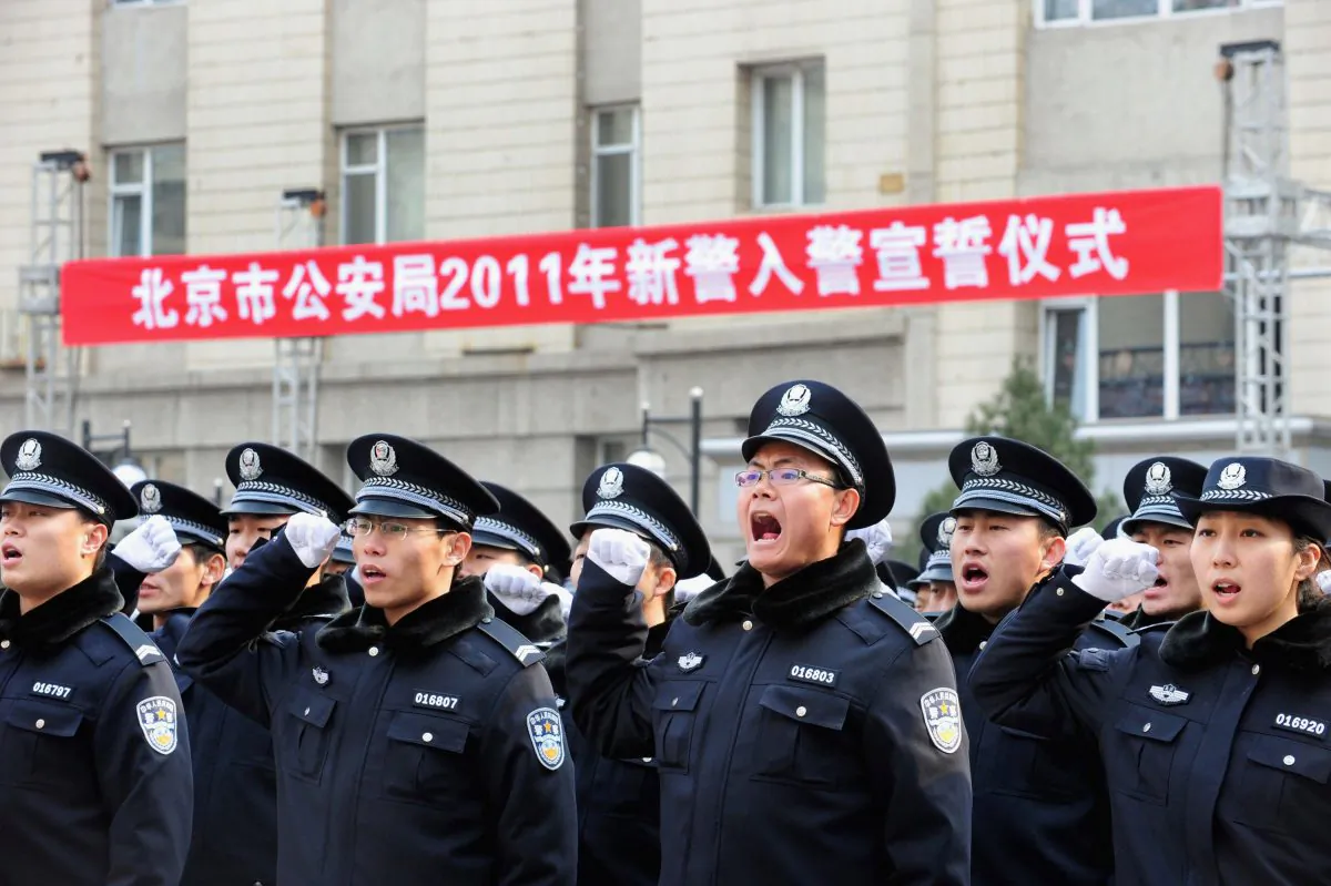 Police recruits shout vows as they join the Beijing Public Security Bureau on February 18, 2011. (ChinaFotoPress/Getty Images)