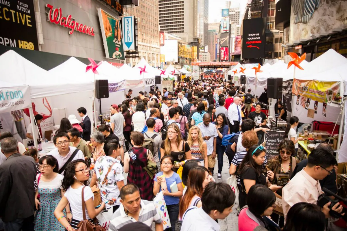 People walk through the food vendor booths at the 2015 Taste Asia Food Festival on Times Square in New York on June 26, 2015. (Edward Dai/Epoch Times)