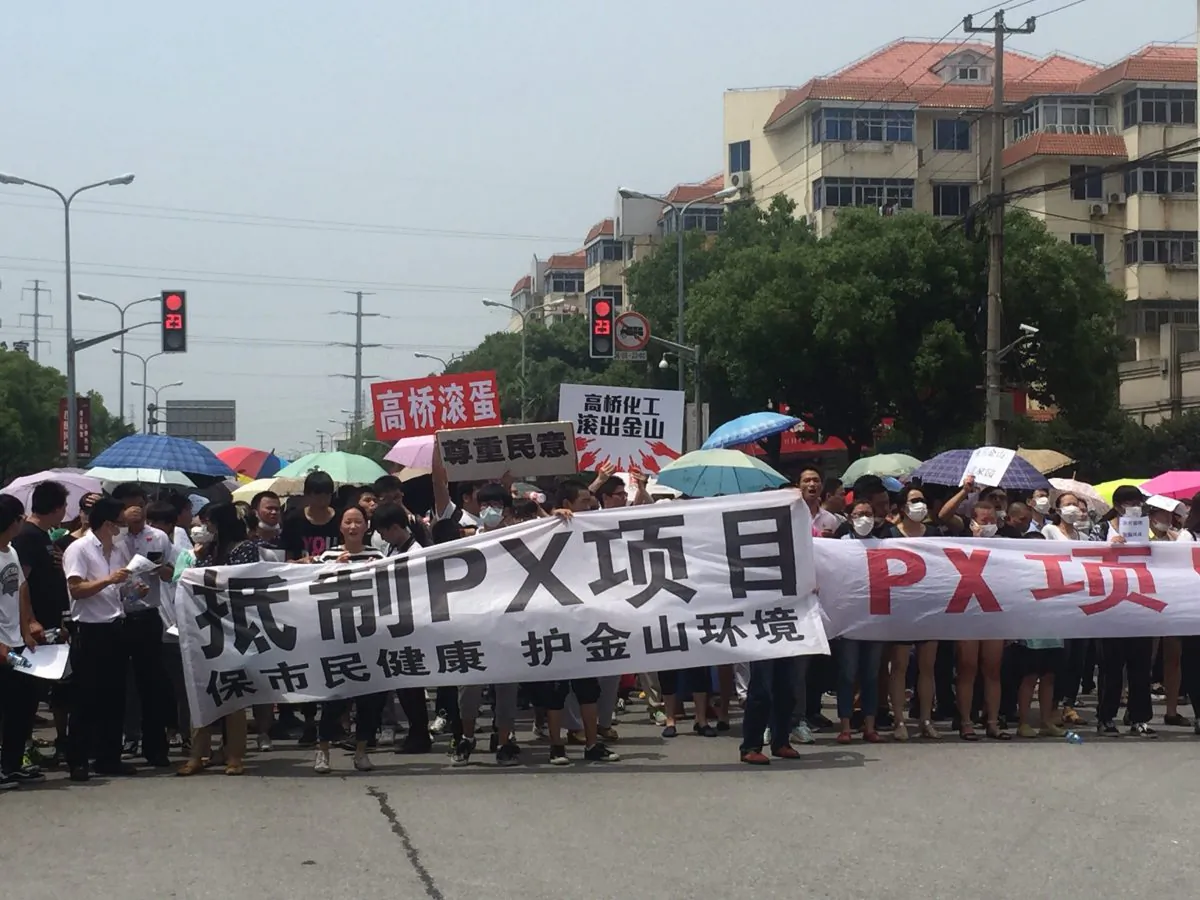 Demonstrators hold banners with slogans to protest against a paraxylene (PX) project in Jinshan district in Shanghai on June 23, 2015. (STR/AFP/Getty Images)