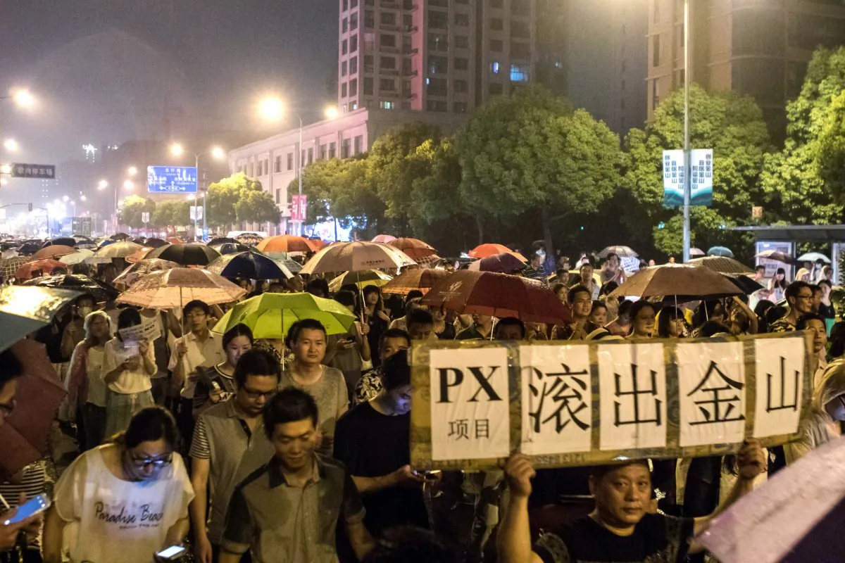 Demonstrators hold banners with slogans to protest against a paraxylene (PX) project in Jinshan district in Shanghai on June 23, 2015. (Vicente Miña/AFP/Getty Images)