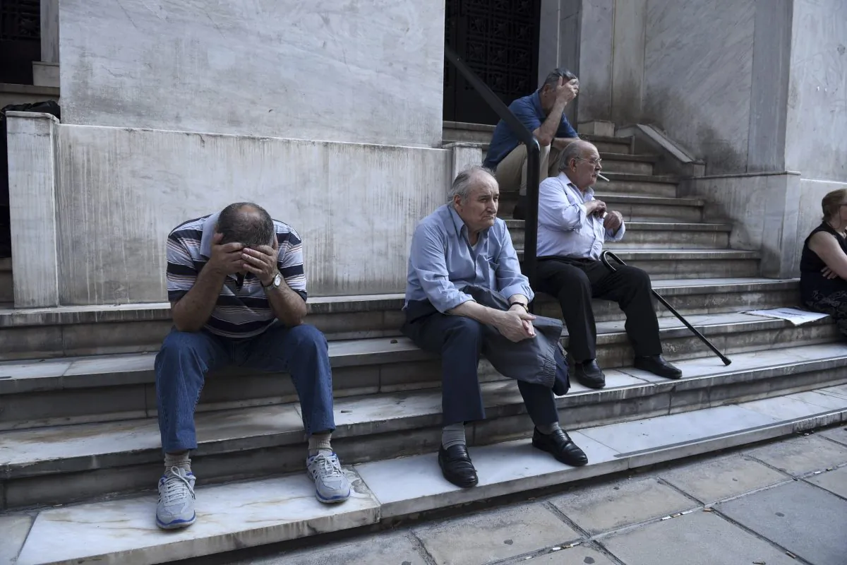 Elderly people, who usually get their pensions at the end of the month, wait outside a closed bank in the northern Greek port city of Thessaloniki, Monday, June 29, 2015. (AP Photo/Giannis Papanikos)