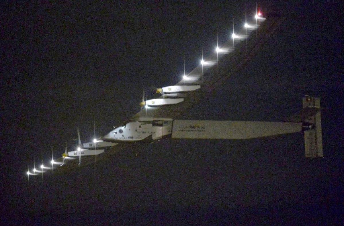 The Solar Impulse 2 flies over Nagoya Airport after taking off in Toyoyama, near Nagoya, central Japan, early Monday, June 29, 2015. (Kyodo News via AP) 