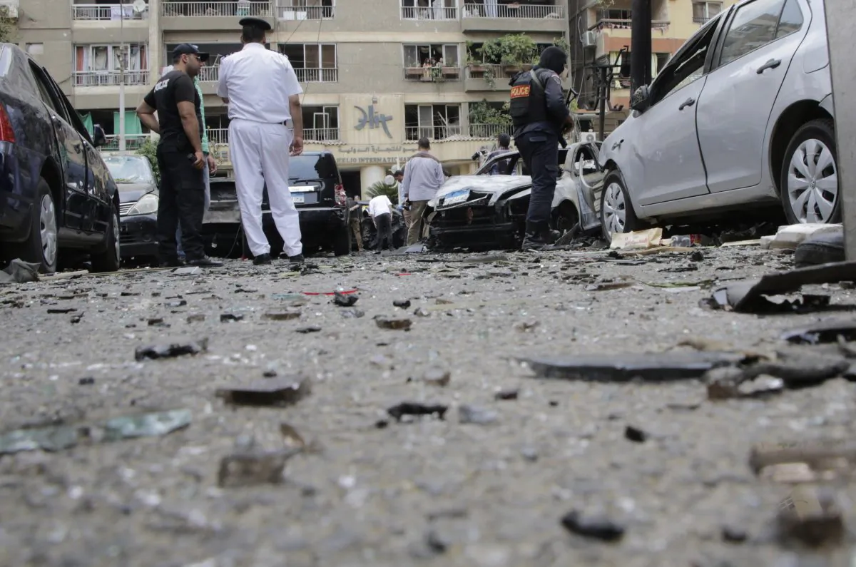 Egyptian security personnel stand guard after a bomb attack that targeted Egypt's prosecutor general in the Heliopolis district of Cairo, Egypt, Monday, June 29, 2015. (AP Photo/Amr Nabil)