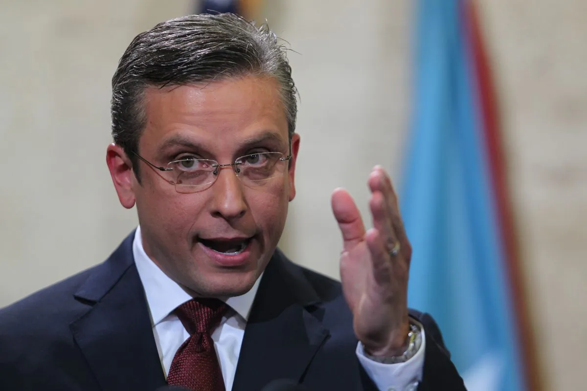 In this April 30, 2015, photo, Puerto Rico Gov. Alejandro Garcia Padilla delivers his budget address for the next fiscal year at the Capitol building in San Juan. Puerto Rico's governor believes the U.S. territory's $72 billion public debt is unpayable, his spokesman confirmed late Sunday, June 28, 2015. (AP Photo/Ricardo Arduengo)