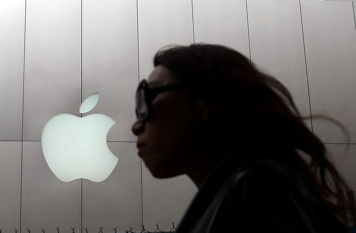 A pedestrian walks by an Apple Store in San Francisco, Calif., on on July 10, 2013. (Justin Sullivan/Getty Images)