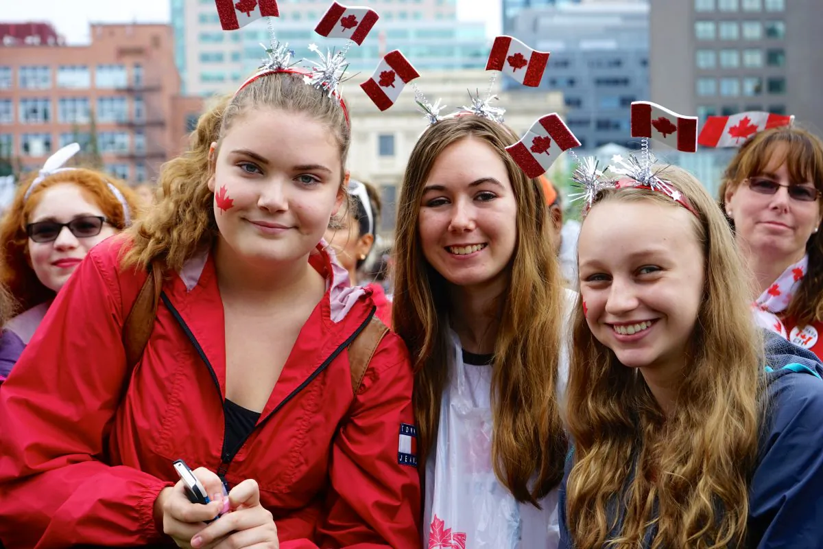 These three young women were among the many who celebrated Canada on Parliment Hill on July 1, the country’s 148th birthday. (Pam McLennan/Epoch Times)