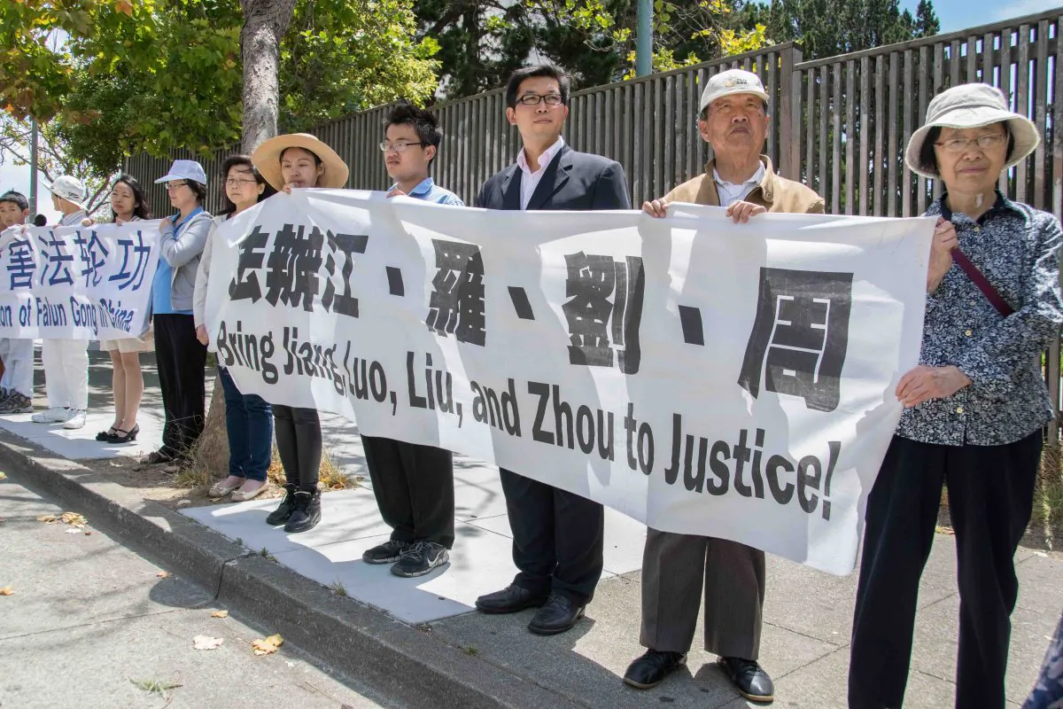 Bay Area Falun Gong practitioners gather at the Chinese Consulate on Laguna St. on July 1 to support lawsuits against dictator Jiang Zemin. (Mark Cao/Epoch Times)